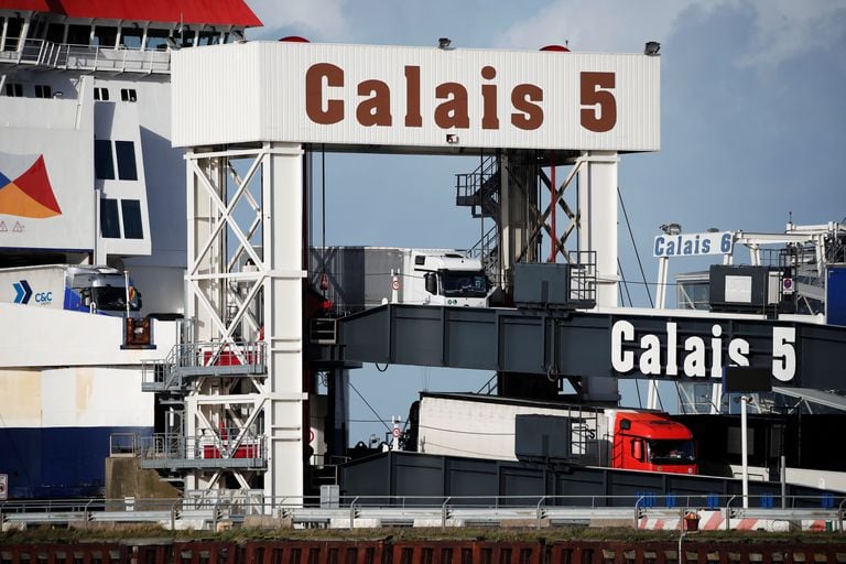 Trucks disembark from a ferry crossing the canal in the port of Calais on Tuesday.