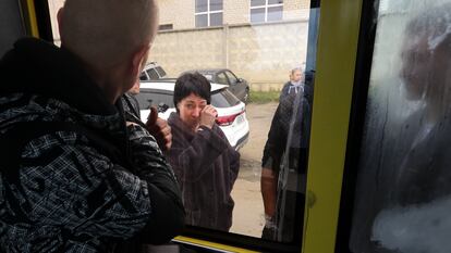 A Russian recruit, back to a camera, looks through a bus window at his mother at a military recruitment center in Volgograd, Russia, Saturday, Sept. 24, 2022. Russian President Vladimir Putin on Wednesday ordered a partial mobilization of reservists to beef up his forces in Ukraine. (AP Photo)