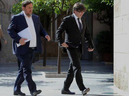 El vicepresidente de la Generalitat, Oriol Junqueras, y el presidente, Carles Puigdemont, este junio.