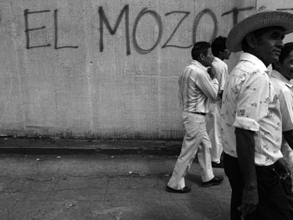 Una pintada sobre la matanza en un muro de El Salvador en 1992.