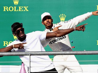 Usain Bolt y Hamilton, en el podio.