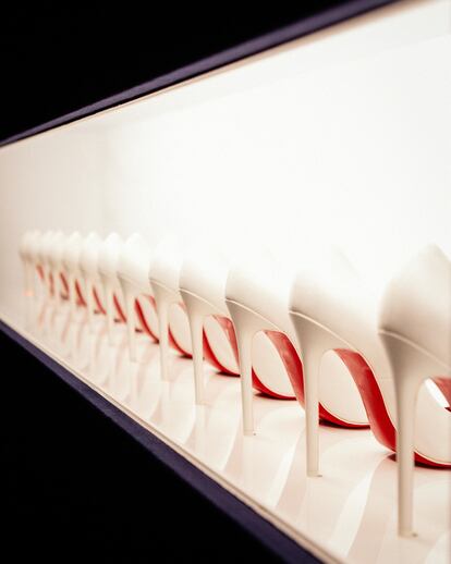 A row of shoes, with the iconic red sole, by Christian Louboutin on display at 'L'Exhibition(niste) Chapter II'.