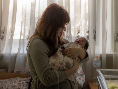 Yulia holds her newborn daughter Diana in a maternity hospital in Pokrovsk, Donetsk region, on January 24, 2024, amid the Russian invasion of Ukraine. This maternity hospital is the only one in the entire Donbas region with a neonatal unit and incubators for babies born prematurely. Despite air raid alerts and shelling, it has worked constantly since Russia invaded almost two years ago. (Photo by Roman PILIPEY / AFP) (Photo by ROMAN PILIPEY/AFP via Getty Images)