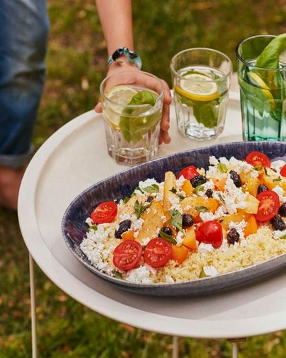 Recipes for the summer dinners report.  'May the night catch us with the table set'.  In the image, Couscous salad with apricot, cherry tomato and feta cheese