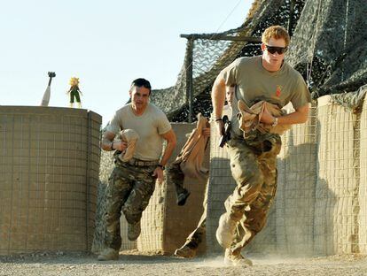 File photo dated 03/11/2012 of Prince Harry (right) or just plain Captain Wales as he was known in the British Army, racing out from the VHR (very high readiness) tent to scramble his Apache with fellow Pilots, during his 12 hour shift at the British controlled flight-line in Camp Bastion southern Afghanistan, where he was serving as an Apache Helicopter Pilot/Gunner with 662 Sqd Army Air Corps, from September 2012 for four months until January 2013. The former soldier said the time he spent in the Army, when he was "just Harry", was "the best escape I've ever had" and he had considered giving up his title. Issue date: Thursday September 8, 2022.