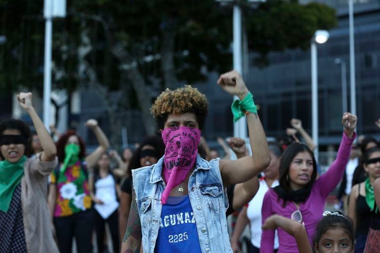 Feminist activists take part in a choreographed performance at the Venezuela square against gender violence and patriarchy in Caracas on December 6, 2019. Tens of women, performed "The rapist is you", the song of a feminist performace which emerged amid the social crisis in Chile and became viral around the world. (Photo by Ramses Mattey/NurPhoto)