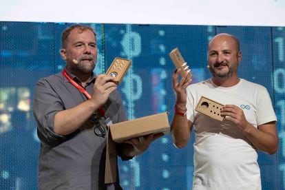 Massimo Banzi and Giuseppe Pinto display the kit needed to build a musical instrument at Makers Faire in Rome.