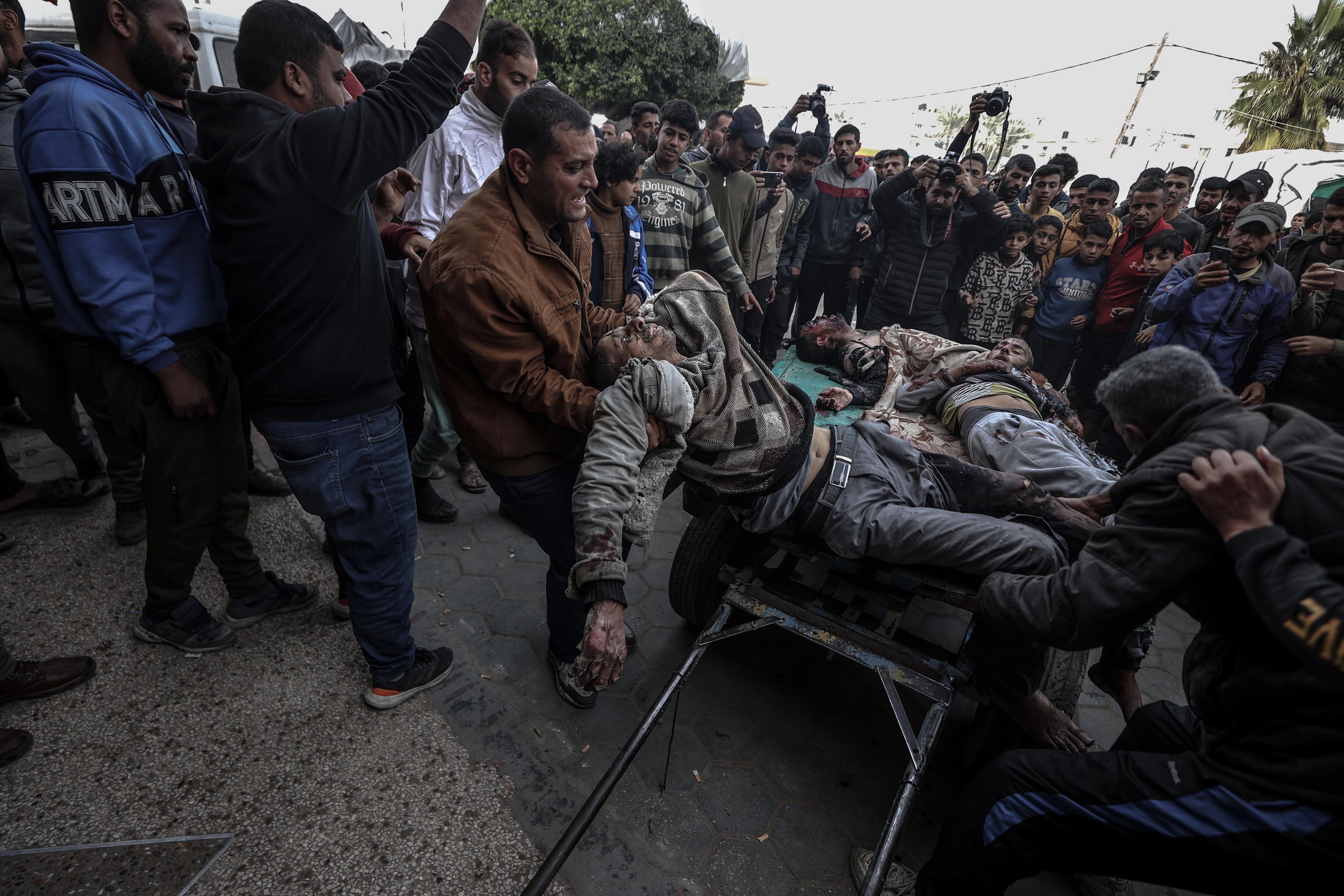 DEIR AL BALAH, GAZA - JANUARY 08: (EDITORS NOTE: Image depicts graphic content) Injured Palestinians are brought to Al-Aqsa Martyrs Hospital with a horse car due to shortage of proper equipment as Israeli attacks continue in Deir al Balah, Gaza on January 08, 2024. (Photo by Ali Jadallah/Anadolu via Getty Images)