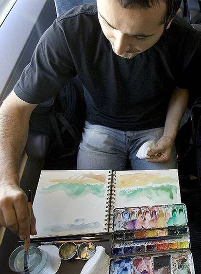 Un dibujante en el AVE a Madrid.
