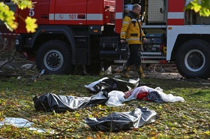 Several bodies remain on the ground after the attack on a residential building in Zaporizhia.