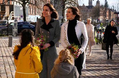 Kate, Duchess of Cambridge, and Mary, Princess of Denmark, greet children upon their arrival at the Danner Crisis Center in Copenhagen, on February 23, 2022.