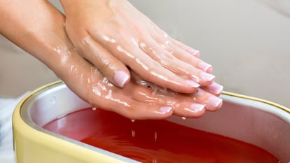 Paraffin to relieve pain in hands and feet.  GETTY IMAGES.