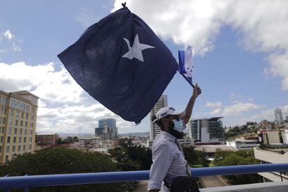 A supporter of the National Party.  attends an electoral rally in Tegucigalpa, Honduras.
