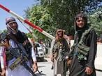 Taliban fighters stand guard along a roadside near the Zanbaq Square in Kabul on August 16, 2021, after a stunningly swift end to Afghanistan's 20-year war, as thousands of people mobbed the city's airport trying to flee the group's feared hardline brand of Islamist rule. (Photo by Wakil Kohsar / AFP)