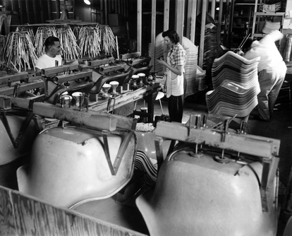 Production of the original Eames Shell armchair.
