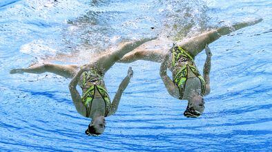 An underwater view shows France's Charlotte Tremble and France's Laura Tremble compete in the preliminary for the women's duet free artistic swimming event during the Tokyo 2020 Olympic Games at the Tokyo Aquatics Centre in Tokyo on August 2, 2021. (Photo by Fran�ois-Xavier MARIT / AFP)