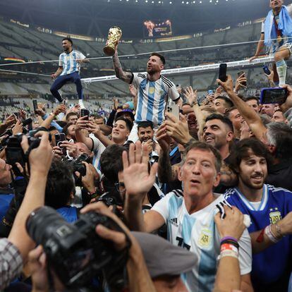 Soccer Football - FIFA World Cup Qatar 2022 - Final - Argentina v France - Lusail Stadium, Lusail, Qatar - December 18, 2022 Argentina's Lionel Messi celebrates with the trophy after winning the World Cup REUTERS/Carl Recine