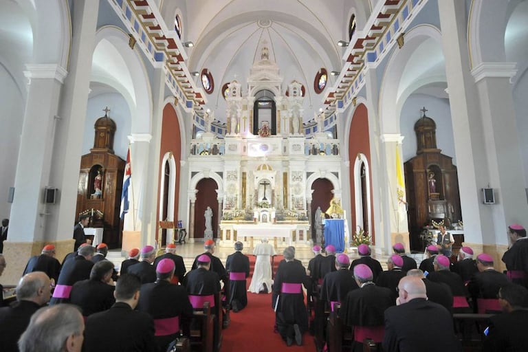 Benedict XVI prays in a church in Santiago de Cuba last year.