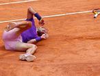 Tennis - ATP Masters 1000 - Italian Open - Foro Italico, Rome, Italy - May 14, 2021 Spain's Rafael Nadal reacts after falling during his quarter final match against Germany's Alexander Zverev REUTERS/Guglielmo Mangiapane