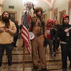 Supporters of US President Donald Trump, including member of the QAnon conspiracy group Jake Angeli, aka Yellowstone Wolf (C), enter the US Capitol on January 6, 2021, in Washington, DC. - Demonstrators breeched security and entered the Capitol as Congress debated the a 2020 presidential election Electoral Vote Certification. (Photo by Saul LOEB / AFP)