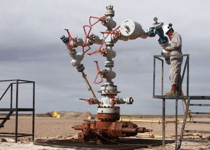 A worker measures pressure at Vaca Muerta, Repsol&#039;s expropriated oil field in Argentina.