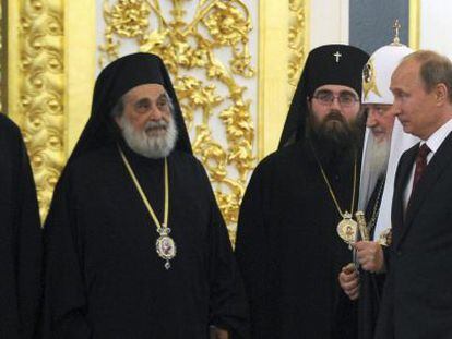 Vladimir Putin junto al patriacta Kirill.