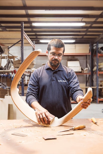 A worker from Andreu World, the only Spanish company that has its entire catalog certified as C2C, makes a chair.