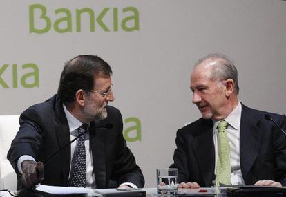 El presidente del Gobierno, Mariano Rajoy, y el exdirigente de Bankia, Rodrigo Rato