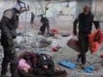 A still image taken from video shows rescue workers inspect bodies scattered in the streets of rebel-held eastern Aleppo after an artillery bombardment
