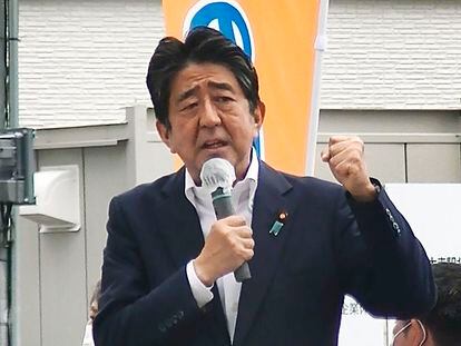 In this image from a video, Japan’s former Prime Minister Shinzo Abe makes a campaign speech in Nara, western Japan shortly before he was shot Friday, July 8, 2022. Abe was shot during the speech and was airlifted to a hospital but he was not breathing and his heart had stopped, officials said. (Kyodo News via AP)