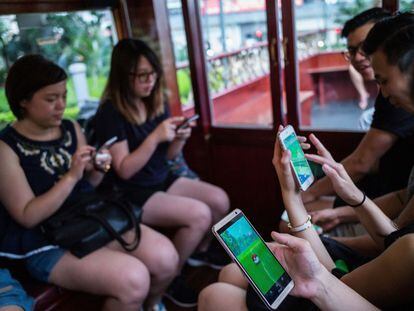 HONG KONG - JULY 30:  People join the Hong Kong&#039;s first Pokemon Go tram party on July 30, 2016 in Hong Kong, Hong Kong. Hundreds of youths attended the 18th Ani-Com and Games Hong Kong fair dressed as Japanese comic characters as the reality smartphone game Pokemon GO was launched in Hong Kong this week following the release of the app in Japan. Based on reports, shopping malls and local businesses in Hong Kong are offering Pokemon-related activities to draw in crowds that have flooded the streets to capture Pokemon while authorities aim to ban the game at public hospitals and schools after receiving complaints from the public.  (Photo by Lam Yik Fei/Getty Images)