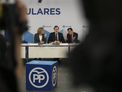 Rajoy, Cospedal y Maillo, este lunes en un acto del PP.