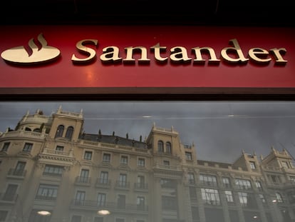 MADRID, SPAIN - JANUARY 29: A Banco Santander's logo stands on a bank's office as a building is reflected on its window a day before a news conference to announce the 2018 results on January 29, 2019 in Madrid, Spain. Banco Santander earned 7,810 million euros in 2018, an 18% increase on the previous year. (Photo by Pablo Blazquez Dominguez/Getty Images)