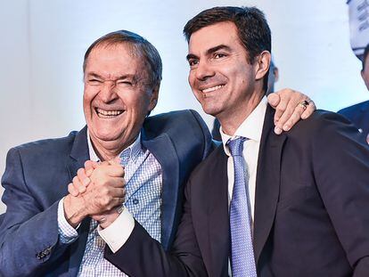 Los peronistas disidentes Juan Schiaretti y Juan Manuel Urtubey.