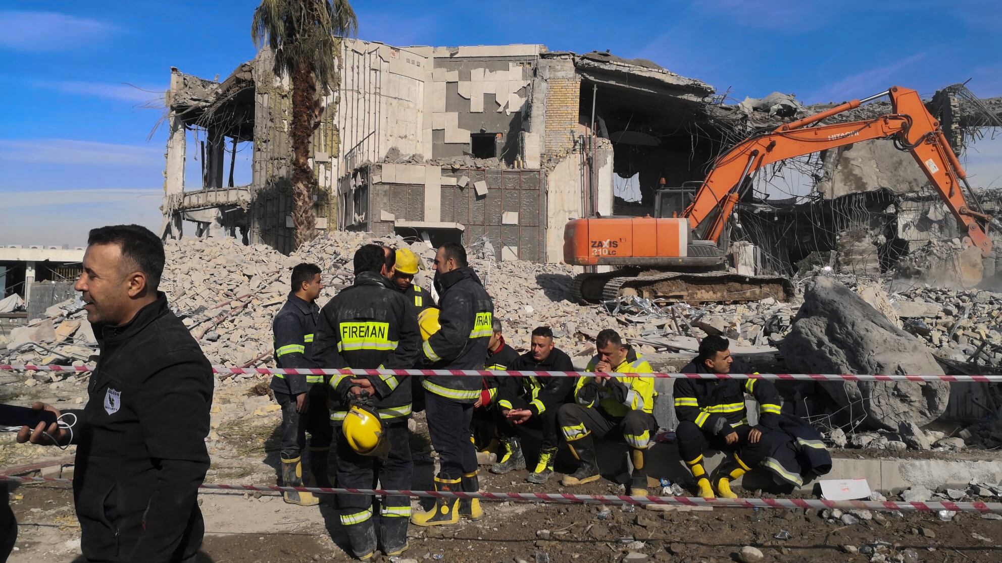 Emergency services clear the rubble of the house of Peshraw Dizayi that was hit in Iranian missile strikes in Irbil, Iraq, Tuesday, Jan. 16, 2024. Dizayi, a prominent local businessman, was killed in one of the Irbil strikes along with members of his family. (AP Photo/Julia Zimmermann/Metrography)