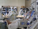 Health workers wearing overalls and protective masks in the new intensive care unit of the Ospedale Maggiore hospital during the second wave of the Covid-19 Coronavirus pandemic, Bologna, Italy, November 26, 2020.