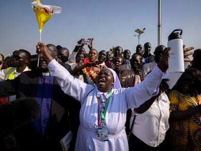 A nun in the crowd shouts that the country needs peace as Pope Francis prepares to leave in his vehicle from the airport in Juba, South Sudan Friday, Feb. 3, 2023. Pope Francis arrived in South Sudan on the second leg of a six-day trip that started in Congo, hoping to bring comfort and encouragement to two countries that have been riven by poverty, conflicts and what he calls a "colonialist mentality" that has exploited Africa for centuries. (AP Photo/Ben Curtis)