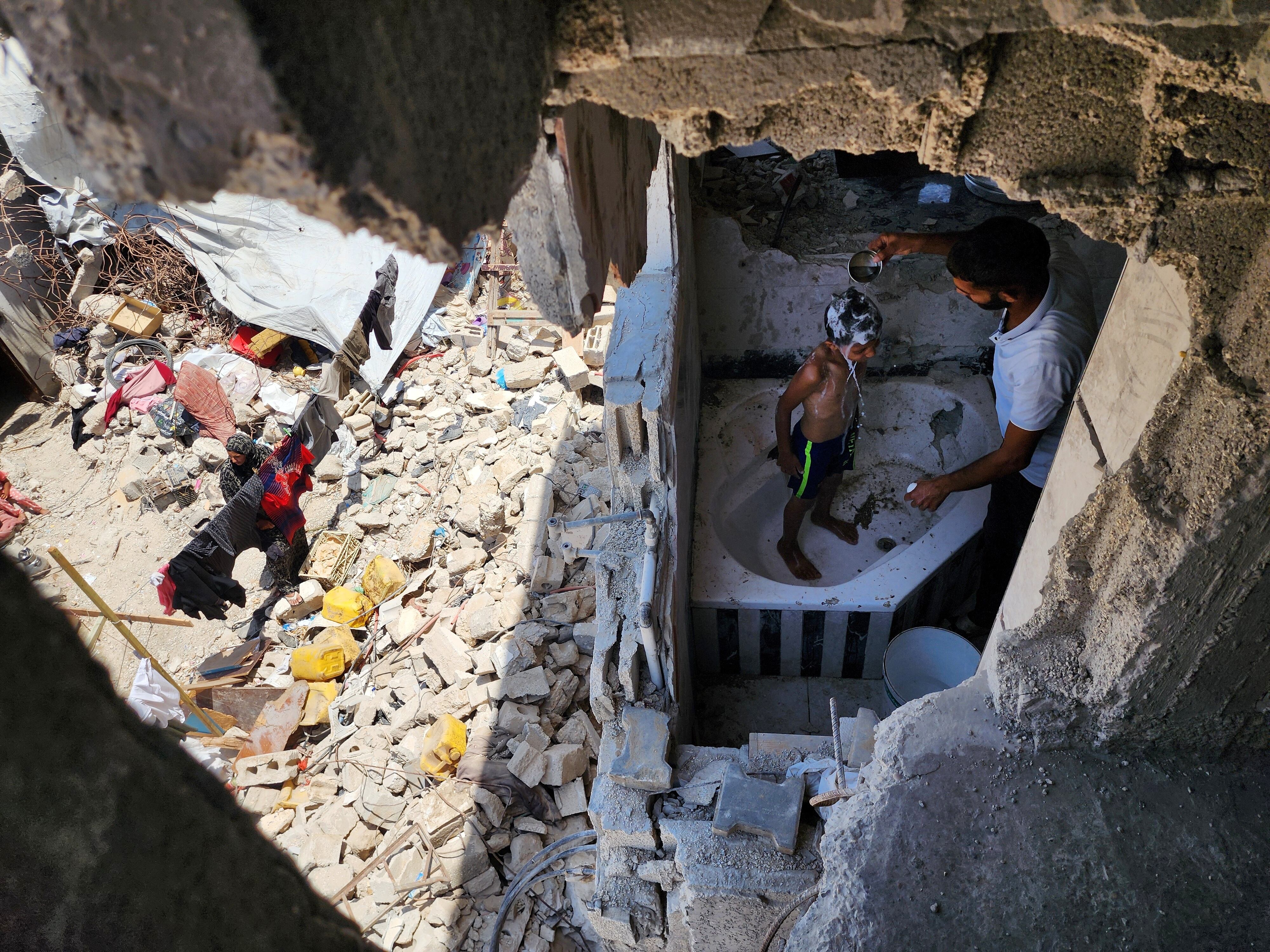 Gazans, including children, in the Bani Suheila area are viewed living with limited means, in Khan Yunis, Gaza on June 20, 2024. Palestinian families hold on to life in the rubble of their homes destroyed by the Israeli army's months-long attacks on Gaza. (Photo by Hani Alshaer/Anadolu via Getty Images)