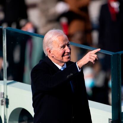 President Joe Biden points to guests attending after the 59th presidential inauguration of US President-elect Joe Biden on the West Front of the US Capitol on January 20, 2021 in Washington, DC. - During today's inauguration ceremony Joe Biden becomes the 46th president of the United States. (Photo by Caroline Brehman / POOL / AFP)