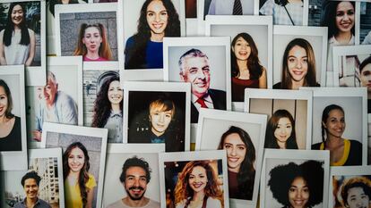 Polaroid photos of different people hanged on the wall.