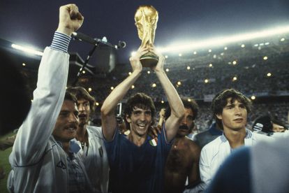 The Italian player Paolo Rossi lifts the World Cup trophy after beating the German team, 3-1, in the 1982 World Cup in Spain.