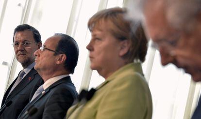 Rajoy, Hollande, Merkel y Monti, el viernes 22 tras la reunión de Roma.