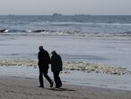KATWIJK, NETHERLANDS - APRIL 29: An elderly couple take a walk along a beach on April 29, 2020 in Katwijk, Netherlands.  (Photo by Yuriko Nakao/Getty Images)