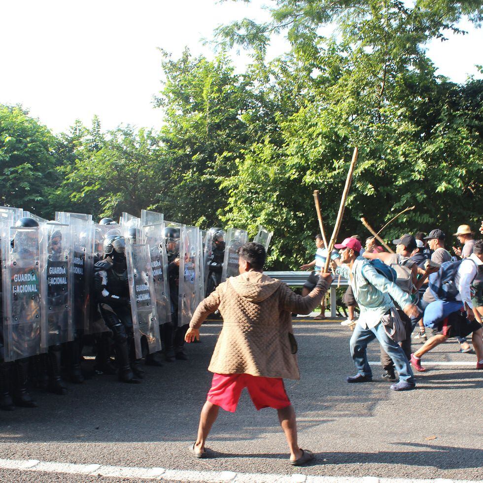 Crisis migratoria La Guardia Nacional se enfrenta con la caravana