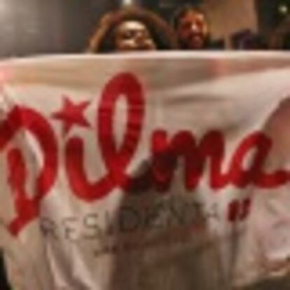 Supporters of Brazil's President Rousseff react to the results of the Brazil general elections in Sao Paulo