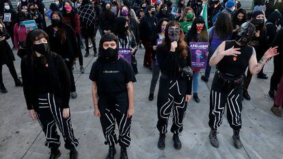 Members of feminist group Las Tesis, who created the performance piece "Un violador en tu camino" (A rapist in your path), take part in a feminist rally calling for a new Constitution in Valparaiso, Chile, October 14, 2020. REUTERS/Rodrigo Garrido
