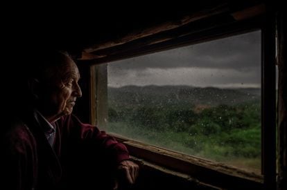 Arturo Olivera watches the decadence of the town from the house where he grew up.