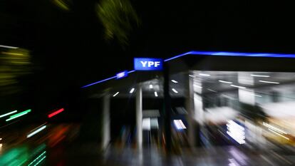 FILE PHOTO: The logo of Argentina's state energy company YPF is seen at a gas station, in Buenos Aires, Argentina February 10, 2021. Picture taken with a slow shutter speed and a zoom effect. Picture taken February 10, 2021. REUTERS/Matias Baglietto/File Photo