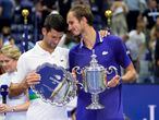 Daniil Medvedev, of Russia, right, talks with Novak Djokovic, of Serbia, after defeating Djokovic in the men's singles final of the US Open tennis championships, Sunday, Sept. 12, 2021, in New York. (AP Photo/John Minchillo)