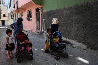 Two Syrian women with children walk in the Turkish city of Sanliurfa on May 17. 